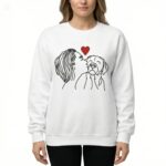 woman kissing dog sweatshirt