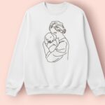 woman hugging dog embroidered sweatshirt